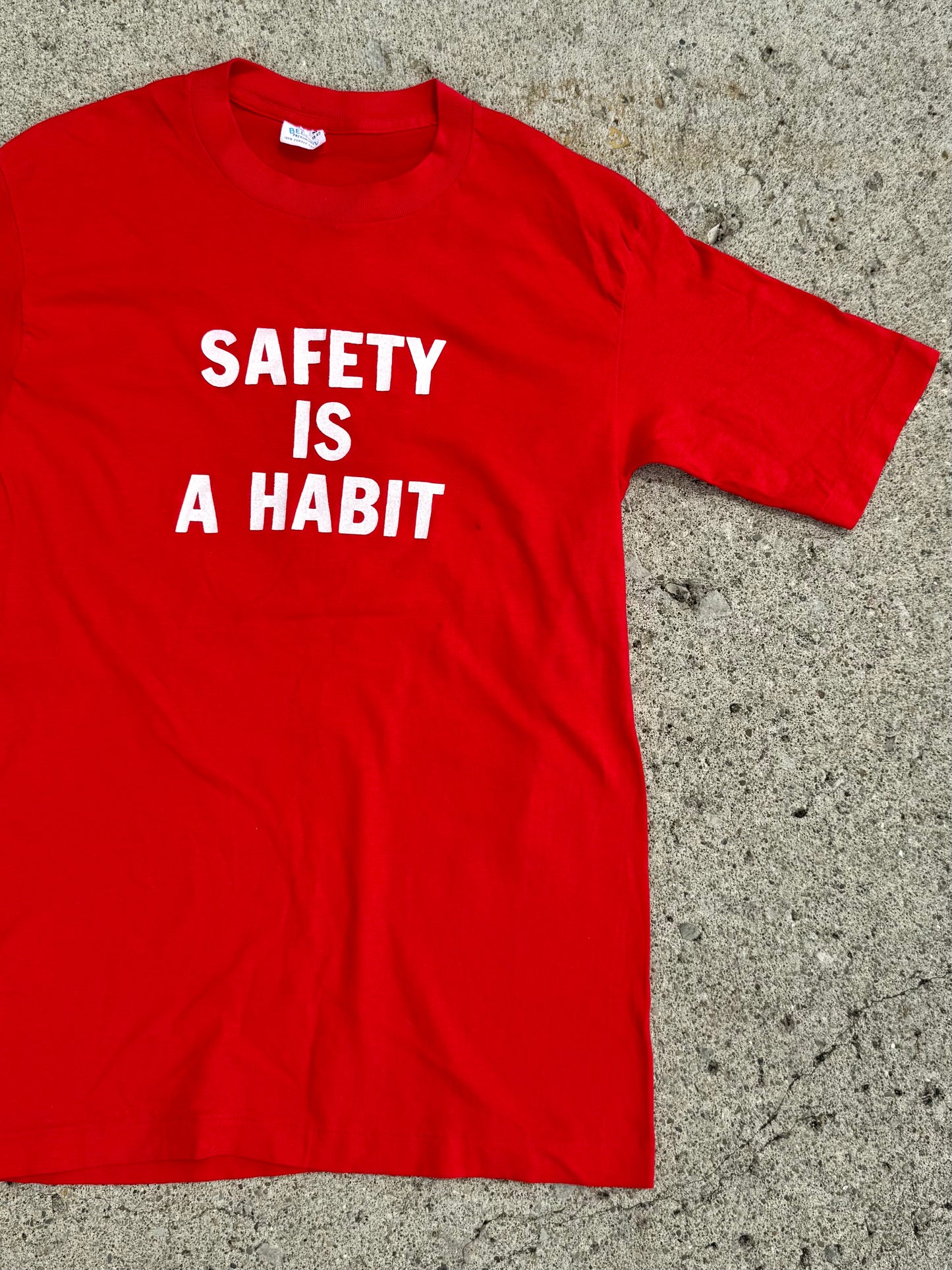 Vintage 1980s Firestone "Safety is a Habit" Red Graphic Tee | Medium