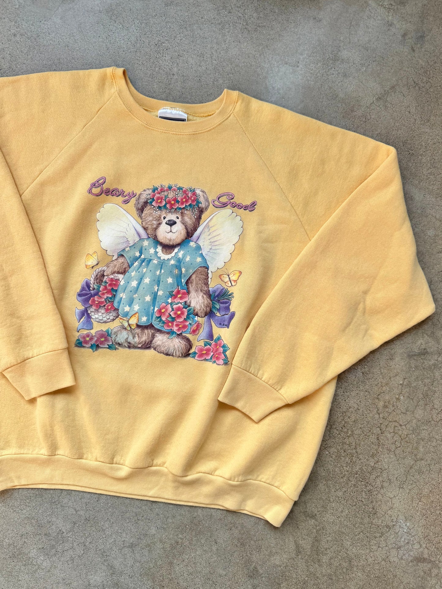Vintage 1990s Yellow “Beary Good” Teddy Bear Angel Graphic Raglan Sweatshirt | XL