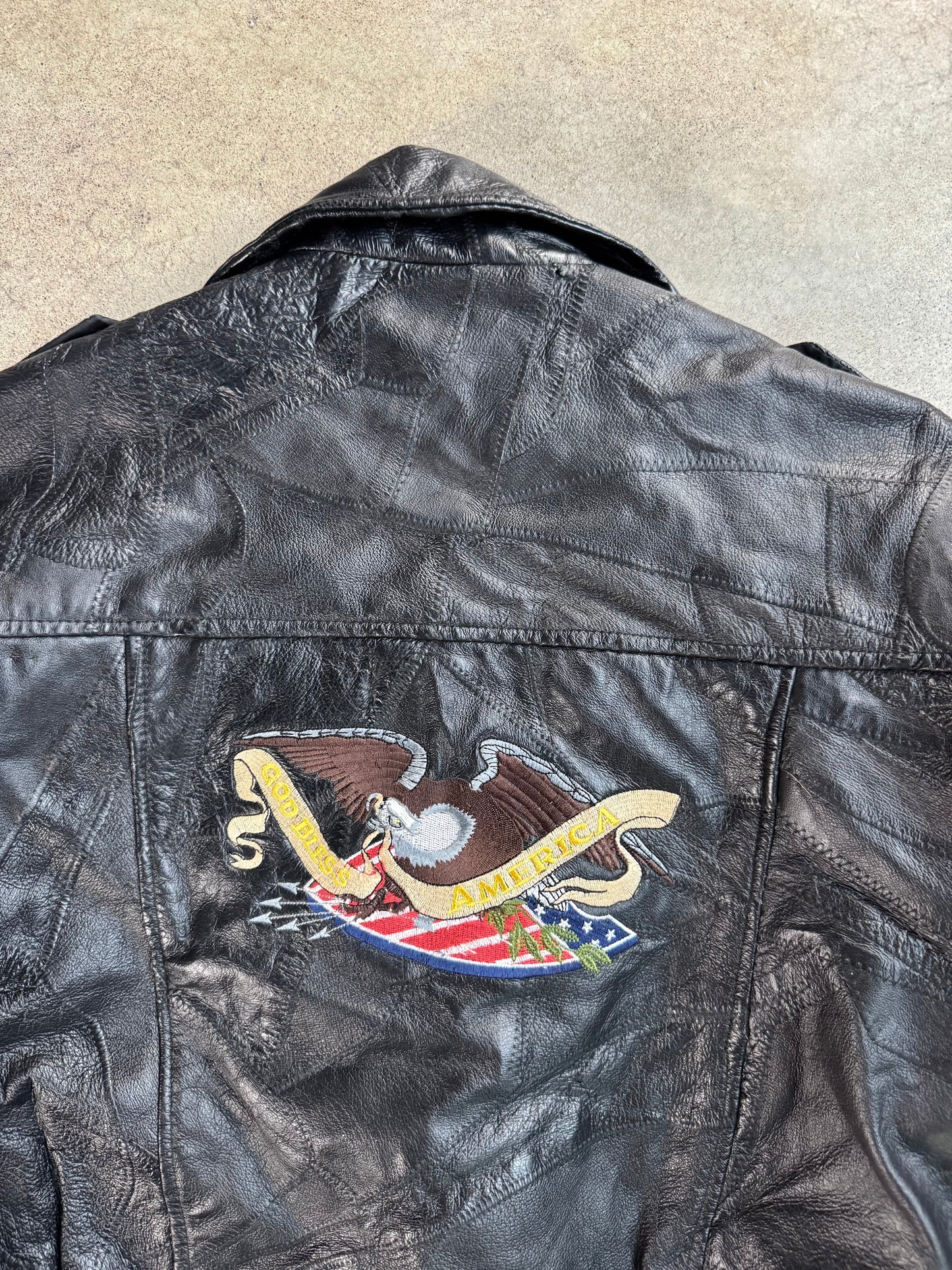 Vintage 1970s Black Leather Patchwork "God Bless America" Biker Jacket | XXL