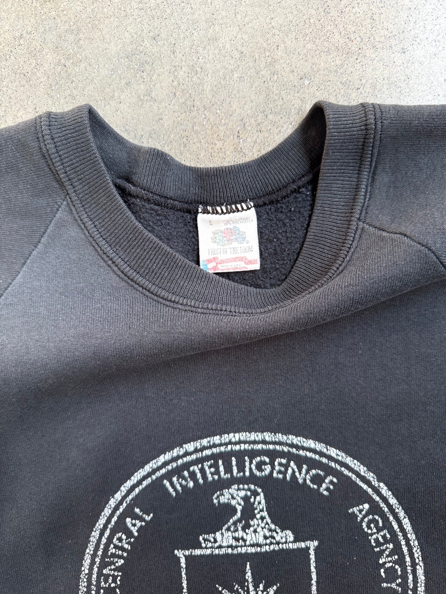 Vintage 1980s Washed Black Central Intelligence Agency Raglan Sweatshirt | Large