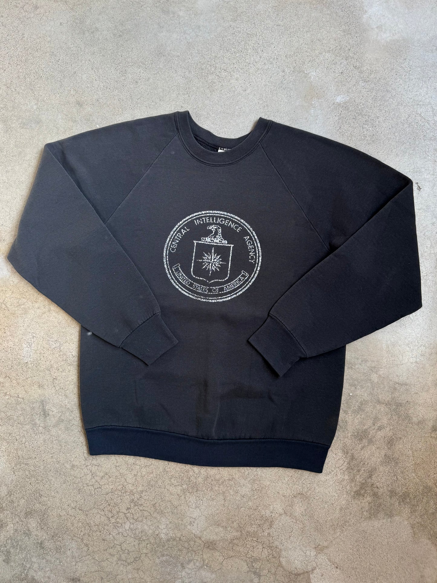 Vintage 1980s Washed Black Central Intelligence Agency Raglan Sweatshirt | Large