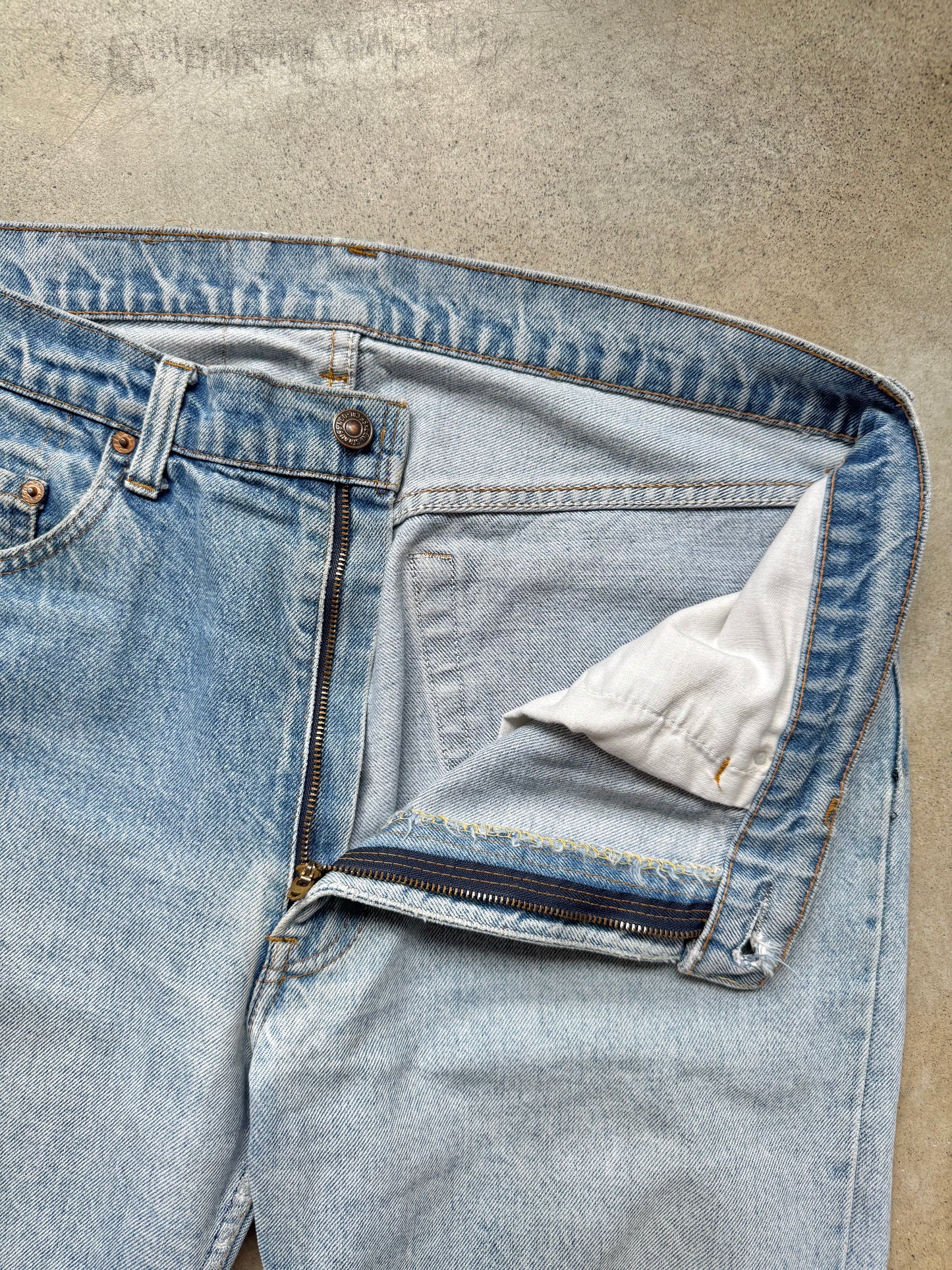 Vintage 1980s Levi’s Frayed Hem Light Wash Jeans | Waist 35”