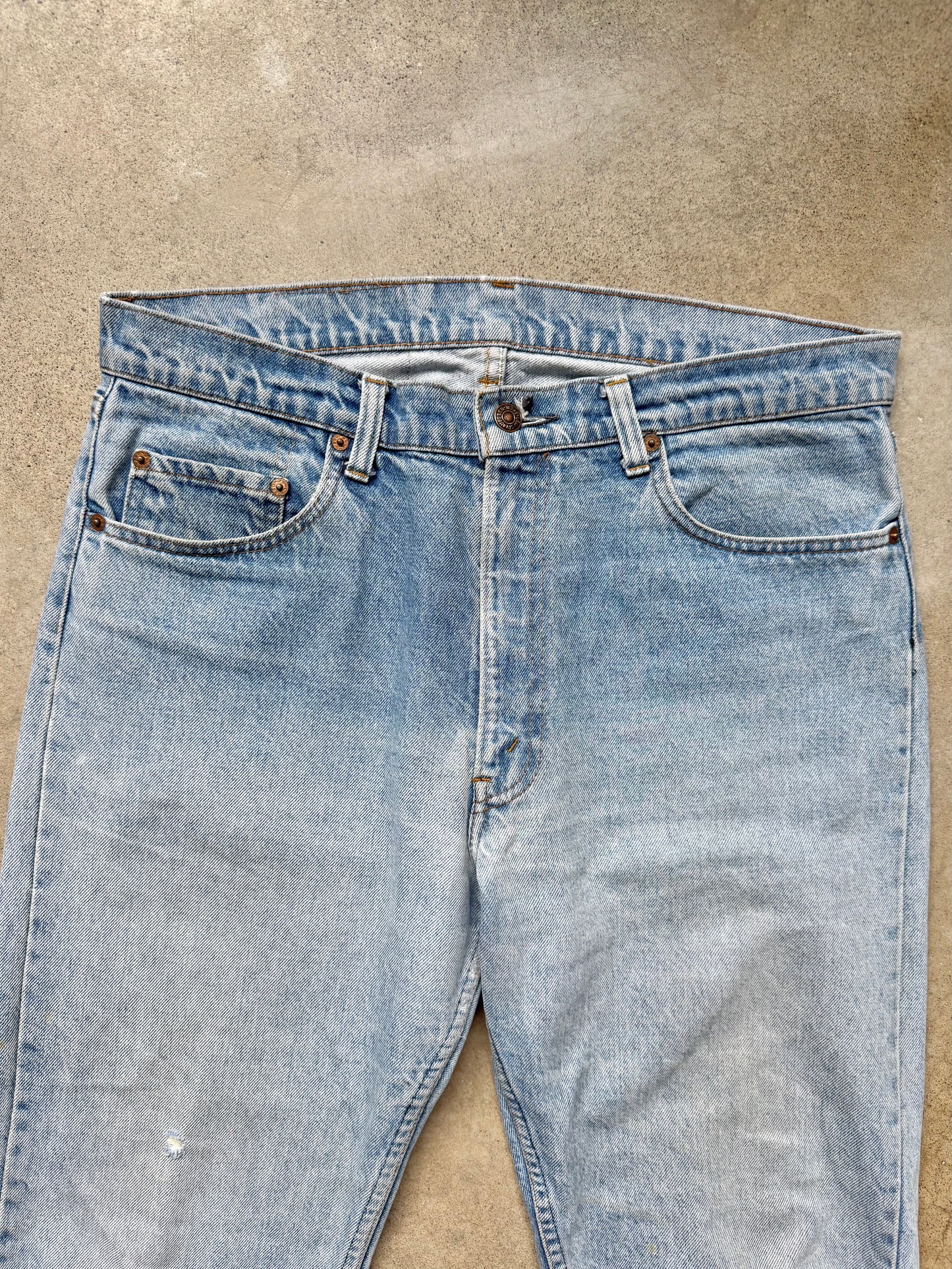 Vintage 1980s Levi’s Frayed Hem Light Wash Jeans | Waist 35”