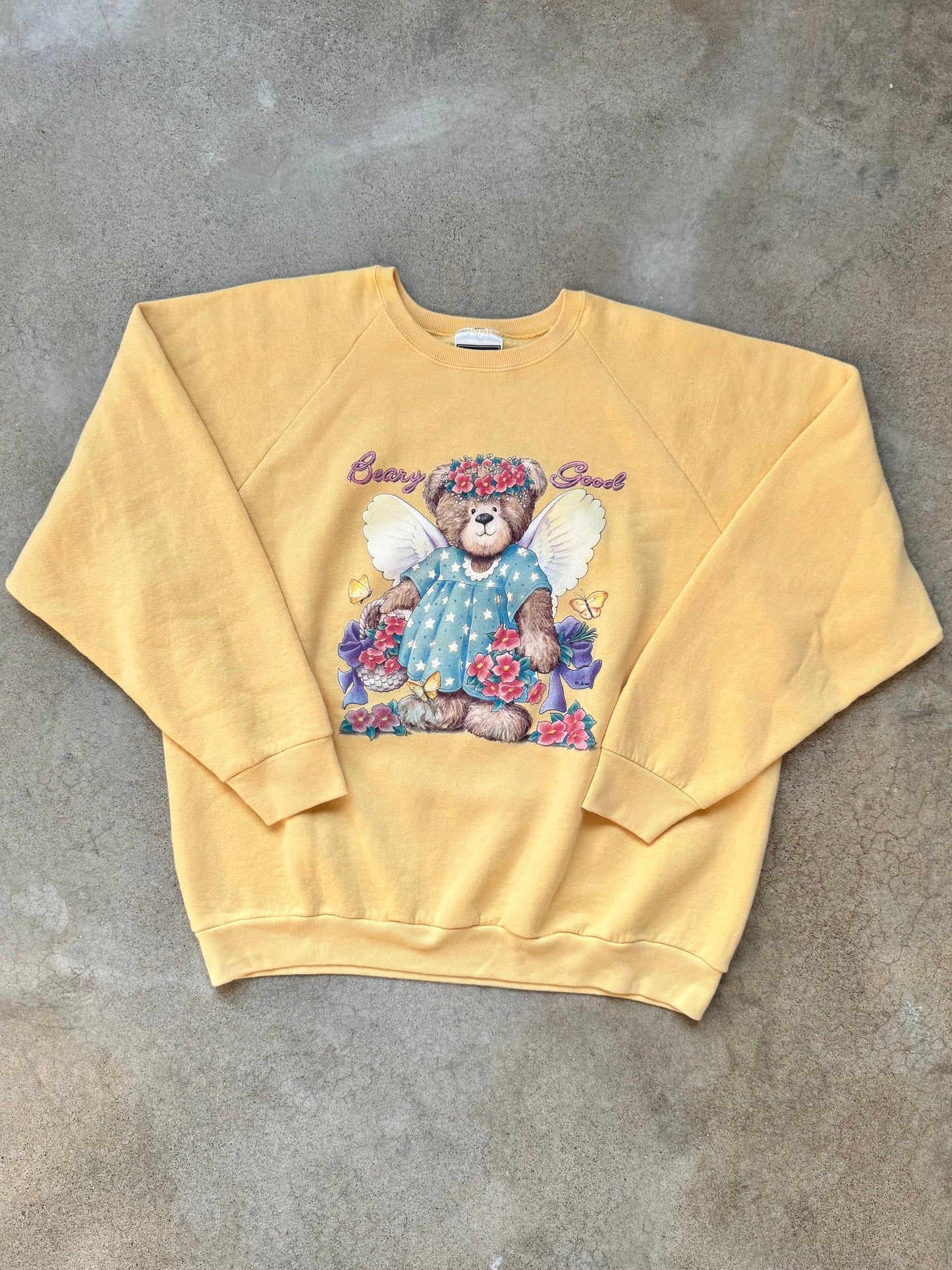 Vintage 1990s Yellow “Beary Good” Teddy Bear Angel Graphic Raglan Sweatshirt | XL