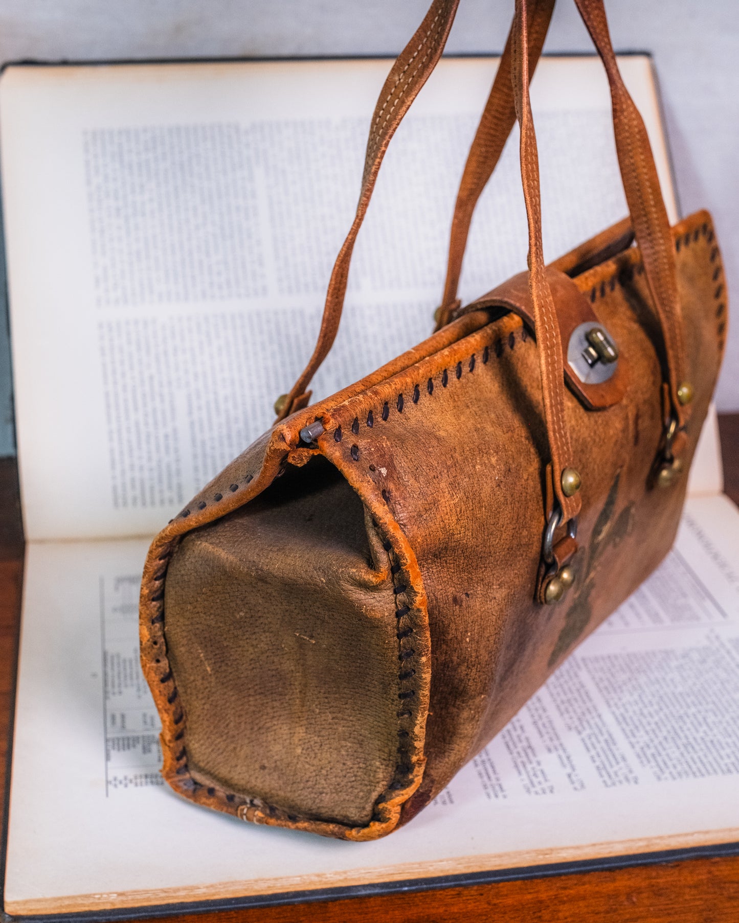 Vintage Distressed Italian Leather Fleur De Lis Emblem Handbag