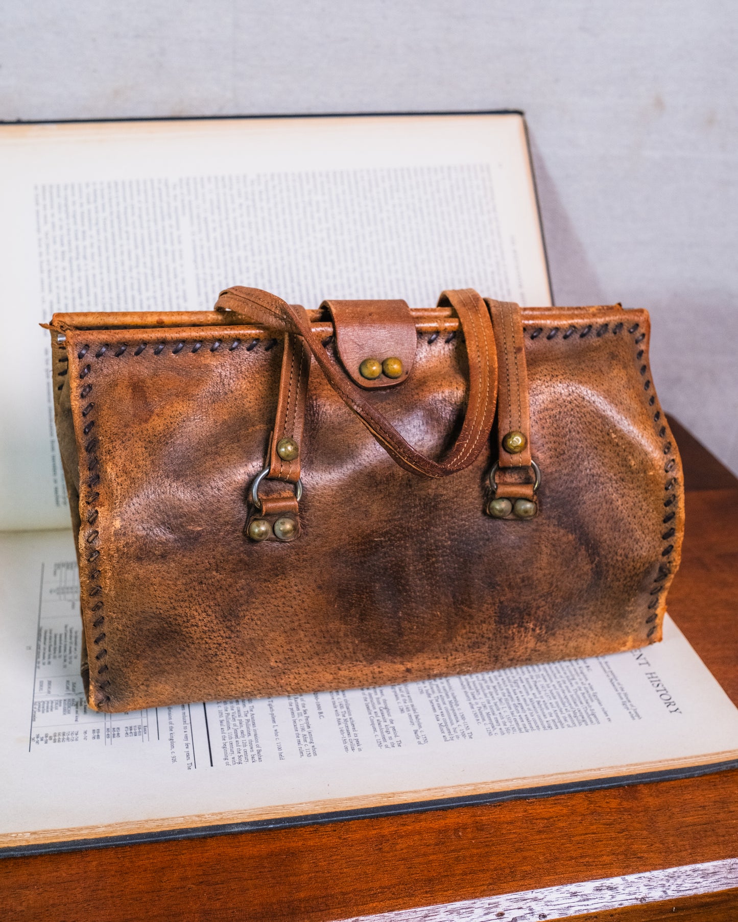Vintage Distressed Italian Leather Fleur De Lis Emblem Handbag