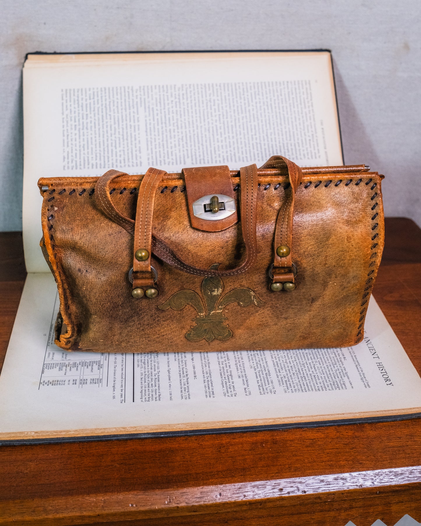 Vintage Distressed Italian Leather Fleur De Lis Emblem Handbag