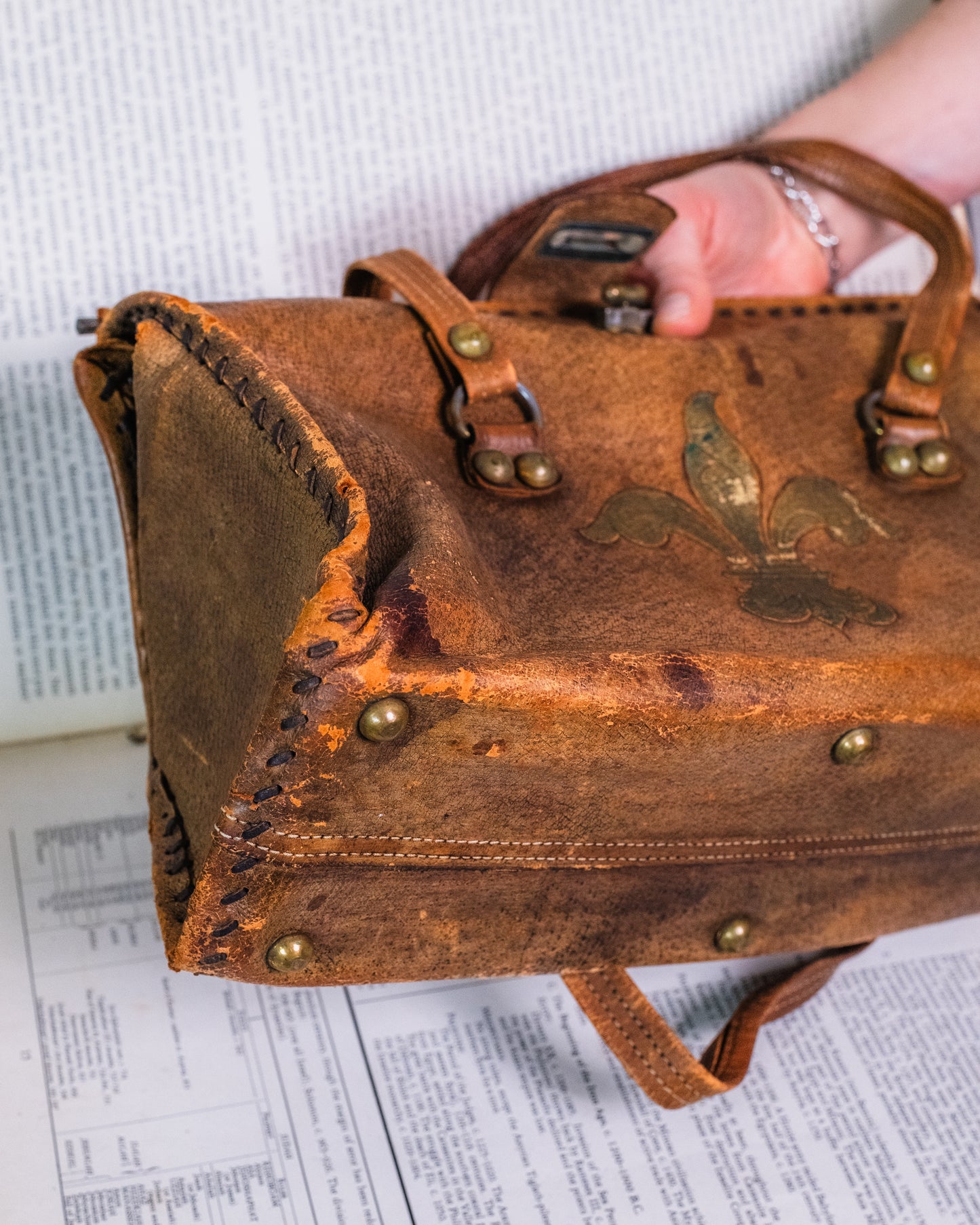 Vintage Distressed Italian Leather Fleur De Lis Emblem Handbag