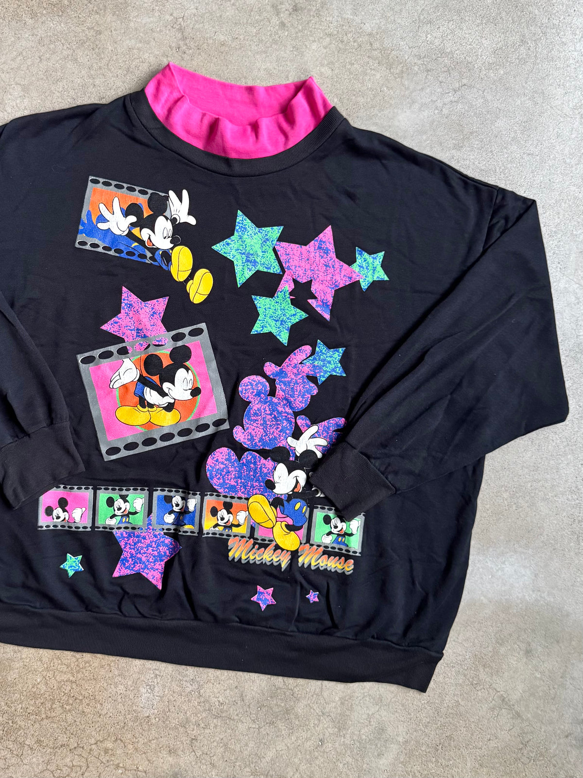 Vintage 1990s Mickey Unlimited Land ‘N Sea Mock Neck Film Strip Graphic Sweatshirt | XXL